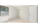 Bedroom features neutral carpet, light gray walls, a window and closet with sliding mirrored doors at 6437 Stone Way, Morrow, GA 30260