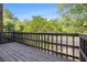 View from deck with wooden railings and trees in background at 6437 Stone Way, Morrow, GA 30260