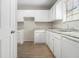 Kitchen with white cabinets and countertops offering a blank canvas for your personal design touches at 6437 Stone Way, Morrow, GA 30260