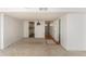 Living room showcases carpeted floors and easy access to kitchen, front door, and a full bathroom at 6437 Stone Way, Morrow, GA 30260