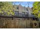 Back of townhomes showing the wooden fence and private decks at 6437 Stone Way, Morrow, GA 30260
