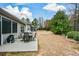 Spacious backyard featuring a patio with furniture, landscaping, and greenery, providing a serene outdoor space at 505 Appalachian Woods Dr, Canton, GA 30114