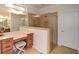 Bright bathroom boasts double vanity, tile floors and glass shower with bench seating at 505 Appalachian Woods Dr, Canton, GA 30114