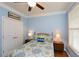 Cozy bedroom featuring a comfortable bed, ceiling fan, closet and natural light from the window at 505 Appalachian Woods Dr, Canton, GA 30114