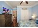 Comfortable bedroom with a TV, dresser, closet, ceiling fan, and access to other areas of the house at 505 Appalachian Woods Dr, Canton, GA 30114