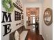 Inviting entryway with hardwood floors, decorative accents, and a charming wooden bench seat at 505 Appalachian Woods Dr, Canton, GA 30114
