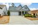 Inviting home featuring a manicured lawn and a two-car garage at 505 Appalachian Woods Dr, Canton, GA 30114