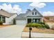 Charming single-story home with a manicured lawn and inviting front porch at 505 Appalachian Woods Dr, Canton, GA 30114