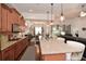 Open kitchen featuring granite countertops, stainless steel appliances, and island with bar seating at 505 Appalachian Woods Dr, Canton, GA 30114