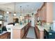 Open concept kitchen with stone counters, stainless appliances, and an open floor plan to the living area at 505 Appalachian Woods Dr, Canton, GA 30114