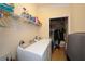Laundry room with shelving for storage and a washer and dryer at 505 Appalachian Woods Dr, Canton, GA 30114