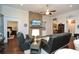 The living room features a stone fireplace, a ceiling fan, and recessed lighting at 505 Appalachian Woods Dr, Canton, GA 30114