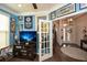 Office with New York Yankees decor, hardwood floors, and a glass door at 505 Appalachian Woods Dr, Canton, GA 30114