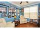 Office with two reclining chairs, New York Yankees decor, and a large window at 505 Appalachian Woods Dr, Canton, GA 30114