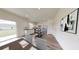 Open kitchen features an island and stainless appliances, seamlessly connects to the dining area at 7728 Sudbury Cir, Covington, GA 30014