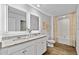 Modern bathroom with double sinks, granite countertops, and a luxurious bathtub and shower combo at 1645 Fuma Leaf Way, Mcdonough, GA 30253