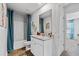 Bathroom with a vanity, a mirror, neutral colors, and a combination shower and tub at 1645 Fuma Leaf Way, Mcdonough, GA 30253