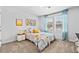 Bright bedroom with natural light, blue curtains, and a cozy decorative theme at 1645 Fuma Leaf Way, Mcdonough, GA 30253