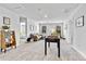 Spacious bonus room with comfortable seating, a foosball table, and plenty of natural light for Gathering enjoyment at 1645 Fuma Leaf Way, Mcdonough, GA 30253