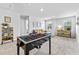 Inviting bonus room featuring a foosball table, a cozy seating area, and a well-lit study corner at 1645 Fuma Leaf Way, Mcdonough, GA 30253