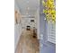 Inviting foyer with stylish flooring, modern decor, and a glimpse into the open-concept kitchen at 1645 Fuma Leaf Way, Mcdonough, GA 30253