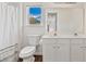 Bathroom includes double sinks, a toilet, a large mirror, and a shower curtain at 3130 Caney Creek Ln, Cumming, GA 30041