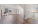 Bright bonus room features dark hardwood floors and a large window letting in natural light at 3130 Caney Creek Ln, Cumming, GA 30041