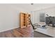 Office space features built-in bookshelves, a large window, and hardwood flooring at 3130 Caney Creek Ln, Cumming, GA 30041