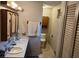 Well-lit bathroom featuring double sinks and neutral tones at 8395 Atlanta Newnan Rd, Chattahoochee Hills, GA 30268