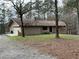 Charming single-story home with attached garage on a spacious wooded lot at 8395 Atlanta Newnan Rd, Chattahoochee Hills, GA 30268