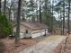Large garage with multi-car capacity and separate entry door at 8395 Atlanta Newnan Rd, Chattahoochee Hills, GA 30268