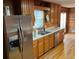 Kitchen with stainless steel refrigerator and ample counter space at 8395 Atlanta Newnan Rd, Chattahoochee Hills, GA 30268