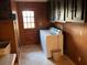 Convenient laundry room with appliances, a sink, and storage cabinets at 8395 Atlanta Newnan Rd, Chattahoochee Hills, GA 30268