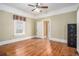 Bedroom with original hardwood floors, white trim, period-style details, and ample natural light at 1200 Dekalb Ave, Atlanta, GA 30307