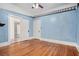 Open bedroom with hardwood floors and multiple entry doors at 1200 Dekalb Ave, Atlanta, GA 30307