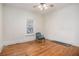 Bedroom features hardwood floors, window, and ceiling fan with light at 1200 Dekalb Ave, Atlanta, GA 30307