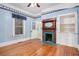 Charming bedroom includes hardwood floors, vintage wallpaper and decorative fireplace at 1200 Dekalb Ave, Atlanta, GA 30307