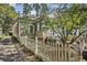 Charming home features a picket fence and mature trees at 1200 Dekalb Ave, Atlanta, GA 30307