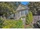 Traditional home featuring classic architecture, mature trees, and a welcoming front yard at 1200 Dekalb Ave, Atlanta, GA 30307