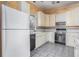 Kitchen features vintage appliances, classic cabinetry, neutral tile backsplash, and tile flooring at 1200 Dekalb Ave, Atlanta, GA 30307