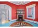 Living room featuring unique compass rose floor, fireplace with wooden mantel, and modern chandelier at 1200 Dekalb Ave, Atlanta, GA 30307