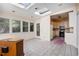 Bright sunroom adjacent to kitchen featuring tile floor, large windows, and ample natural light at 1200 Dekalb Ave, Atlanta, GA 30307