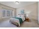 Well-lit bedroom with large windows, neutral colors, and a cozy, inviting atmosphere at 13029 Dartmore Ave, Alpharetta, GA 30005