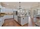 Spacious kitchen with a large island, stainless steel appliances, and hardwood floors at 13029 Dartmore Ave, Alpharetta, GA 30005