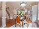 Open-concept kitchen and dining area featuring hardwood floors and stainless steel appliances at 13029 Dartmore Ave, Alpharetta, GA 30005