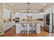 Modern kitchen with stainless steel appliances, granite countertops, and a central island at 13029 Dartmore Ave, Alpharetta, GA 30005