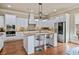 Gourmet kitchen featuring white cabinetry, a center island, and stainless steel appliances at 13029 Dartmore Ave, Alpharetta, GA 30005