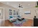 Spacious living area with ample natural light, a comfortable sofa, and stylish decor at 13029 Dartmore Ave, Alpharetta, GA 30005