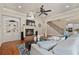 Open-concept living room boasts a fireplace, staircase, and modern furnishings at 13029 Dartmore Ave, Alpharetta, GA 30005