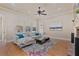 Relaxing living room with large windows, neutral tones, and a cozy seating arrangement at 13029 Dartmore Ave, Alpharetta, GA 30005